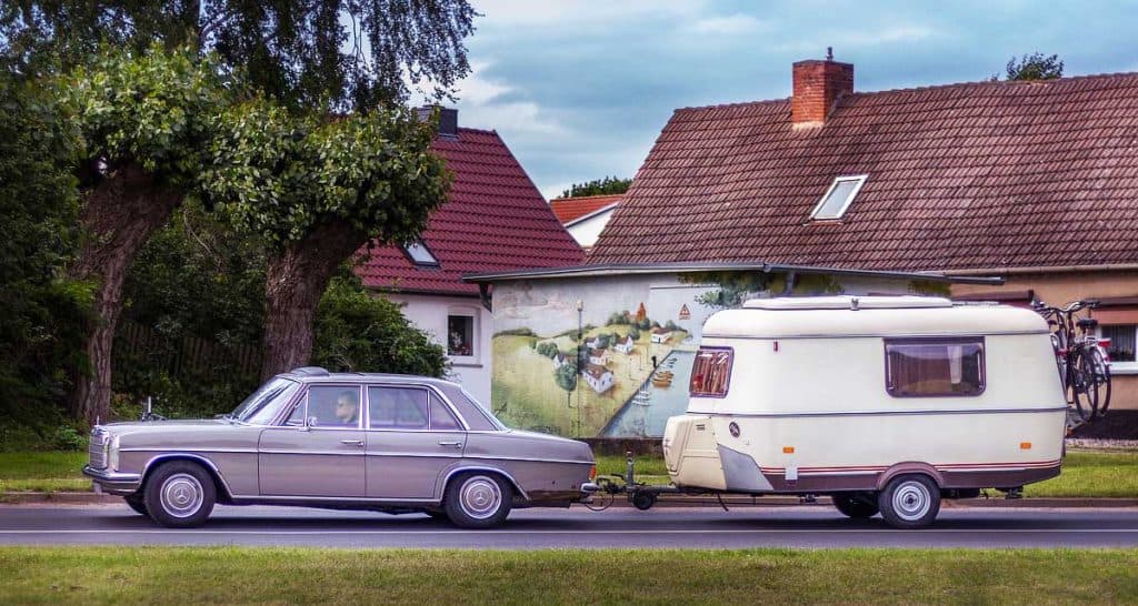 Man going on a camping trip with his caravan